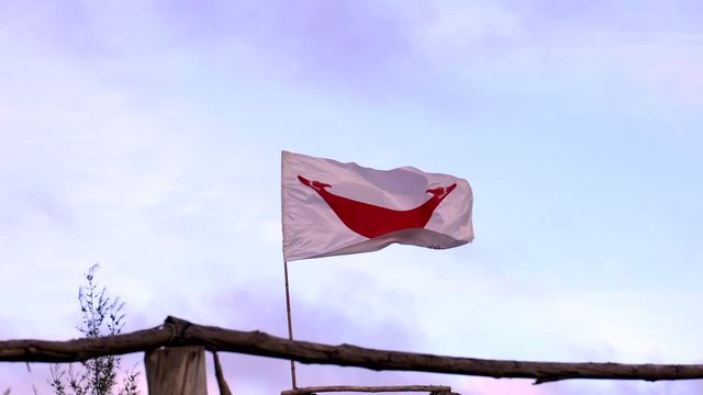 Rapi Nui Native Easter Island Flag Waving in Wind Wide Shot.