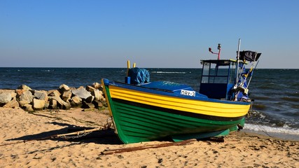 fishing boat placed on the beach in Gdynia, Poland