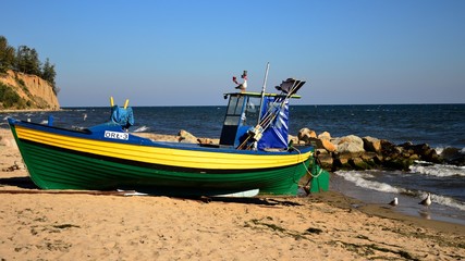 Naklejka na ściany i meble fishing boat placed on the beach in Gdynia, Poland