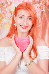 girl holds Heart shape red fluffy soft pillow for Valentine's day love