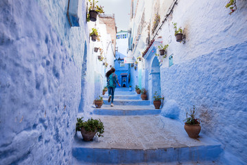 Chefchaouen, Morocco - June 29, 2019 - Girl in the alleys of Chefchaouen - Morocco