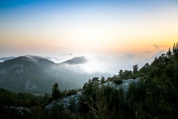Fototapeta na wymiar aerial view of foggy mountains