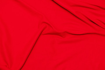 Red crumpled blanket, texture, top view