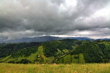 Naklejka premium storm clouds above the mountains