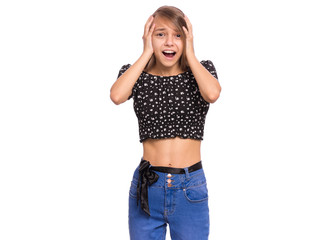 Portrait of teen girl, isolated on white background. Amazed or scared child looking at camera in amazement, touching head with hands. Beautiful caucasian teenager, opening eyes and mouth with fear.