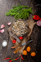 seaweed and carrot salad, mayonnaise sauce, in a rustic rustic bowl bowl, fork knife spoon, spices,...