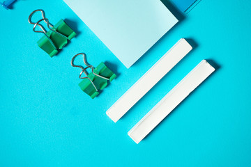 Isometric conposition with chalk, sticker, binder, eraser and pin. Office and back to school cocnept. Flat lay Branding mock up stationery. Copy space. Top view. School supplies