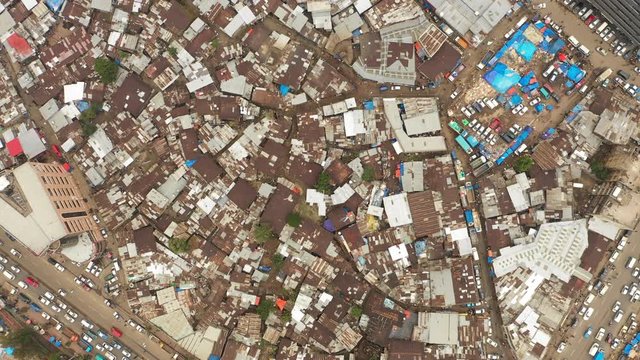 Overhead drone shot flying over rooftops made of corrugated sheets in Mercato marketplace in suburbs Addis Ababa, Ethiopia