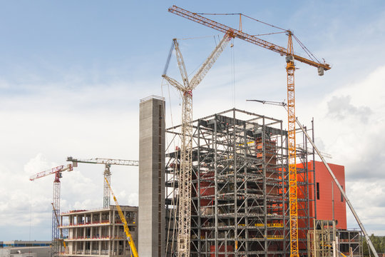 Cranes and building a modern factory building steel structure