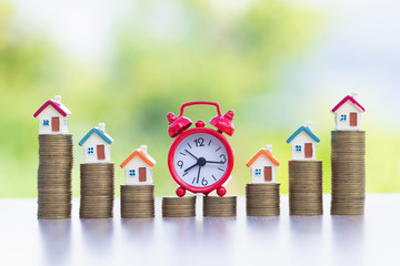 Mini house on stack of coins,Money and house,  Mortgage, Savings money for buy house and loan to...
