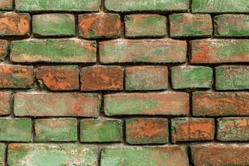 Old green brick wall, rustic texture, design background.
