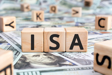 ISA - acronym from wooden blocks with letters, Individual Savings Account abbreviation  ISA concept, random letters around