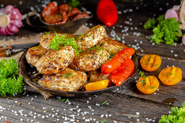 homemade meatballs, cutlets fried from red and white fish meat, in a vintage rustic bowl plate,...