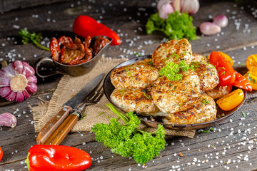 homemade meatballs, cutlets fried from red and white fish meat, in a vintage rustic bowl plate,...