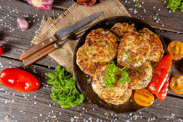 homemade meatballs, cutlets fried from red and white fish meat, in a vintage rustic bowl plate,...