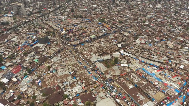 High angle aerial perspective of Mercato market and slum area in suburbs of Addis Ababa, trade business poverty inequality Ethiopia Africa