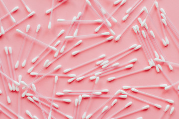  pink cotton buds on a pink background with place for text. cotton bud pattern