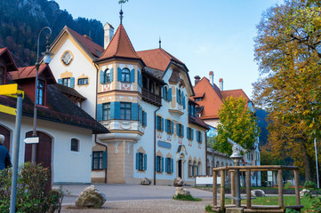 Telescope and lantern near an old house in village in the Alps in autumn in Germany