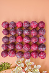 Red plums and white flowers