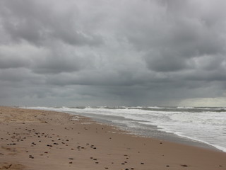 Coast with White Waves and Cloudy Weather