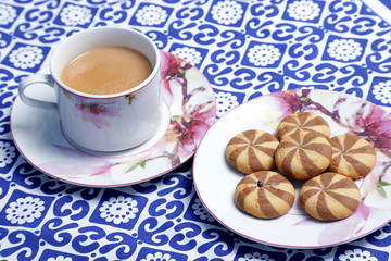 A Cup of tea and a biscuit. A cup of traditional English tea with biscuit.