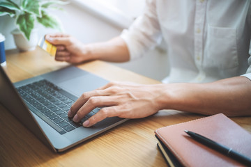 Male hand using credit card with laptop pc, Online shopping and payment concept.