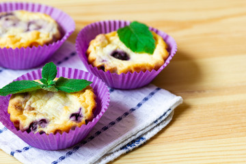 sweet cheese blueberry muffins on a wooden background