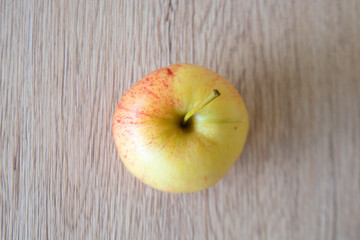 close up red apple isolated on wood background