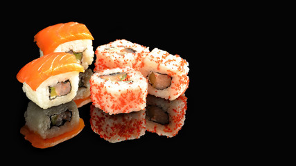 Traditional fresh Japanese sushi rolls. Black background. Reflection. Beautiful set. Japanese cuisine.