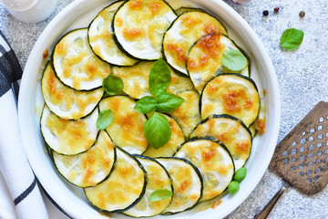 Baked zucchini with parmesan sauce and cheese. Summer zucchini pie.Zucchini casserole.