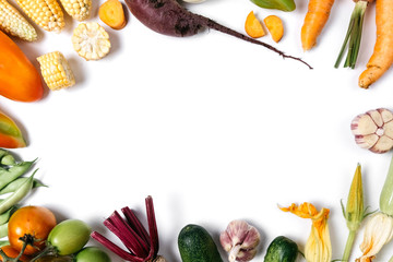 Pattern made of autumn vegetables. Food concept. Tomatoes, onion, cucumber, carrot, garlic, red...