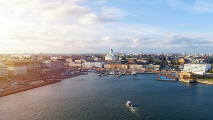 Fototapeta na wymiar Aerial view of beautiful city Helsinki at Autumn. Famous Helsinki Cathedral and Market square in evening light, horizon, autumn skyline.