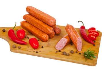 sausages with vegetables on a cutting board