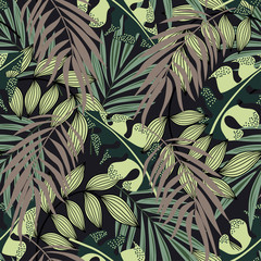 Abstract seamless pattern with colorful tropical leaves and plants on brown background. Vector design. Jungle print. Floral background. Printing and textiles. Exotic tropics. Summer.