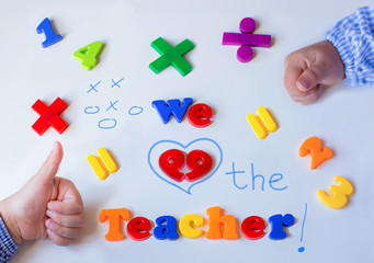 school background with colorful letters and children hands