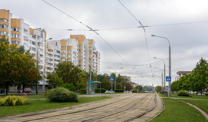 Fototapeta na wymiar Tram road on Dauman street in Minsk. Left embankment of the Svisloch River