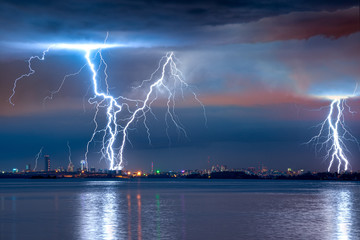 strong thunderstorm with lightning over the city