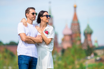 Obraz premium Young dating couple in love walking in city background St Basils Church