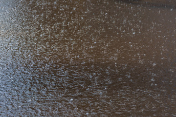 puddle with raindrops,removed during the summer rain in the afternoon