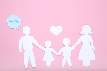Paper family figures with heart and speech bubble on pink background