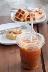 Tableware, coffee, orange juice, lipstick and green straw