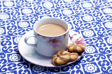 English tea and biscuit. A cup of traditional English tea with biscuit. 