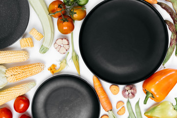 Pattern made of autumn vegetables. Tomatoes, onion, carrot, garlic, red beet, pepper, zucchini,...