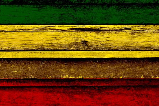 Green yellow red on old wood wall texture,Reggae background concept
