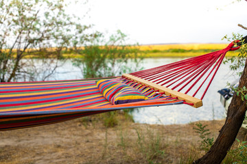 Hammock on the background of the river. Camping in the wild. A weekend away from civilization. Tourism in Kazakhstan.