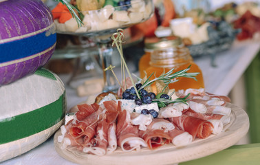 food buffet reception snacks cheese card honey and fruit variety