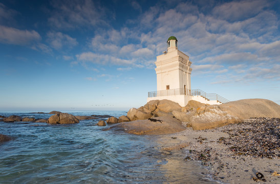 Wide angle panoramic image of the Stompneusbaai lighthouse near Shelley point in town of St Helena Bay on the West coast of South Africa
