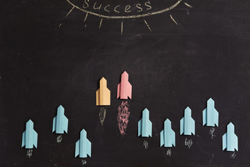 Business organization, corporate subordination, hierarchy and structure: Multicolored paper rockets...