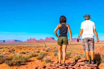 A couple looking at the point where the famous Forrest Gum movie was recorded in Monument Valley