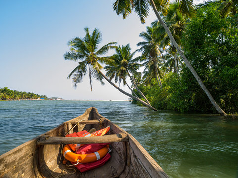 river cruise in the Kerala backwaters with traditional wooden fisherman boat